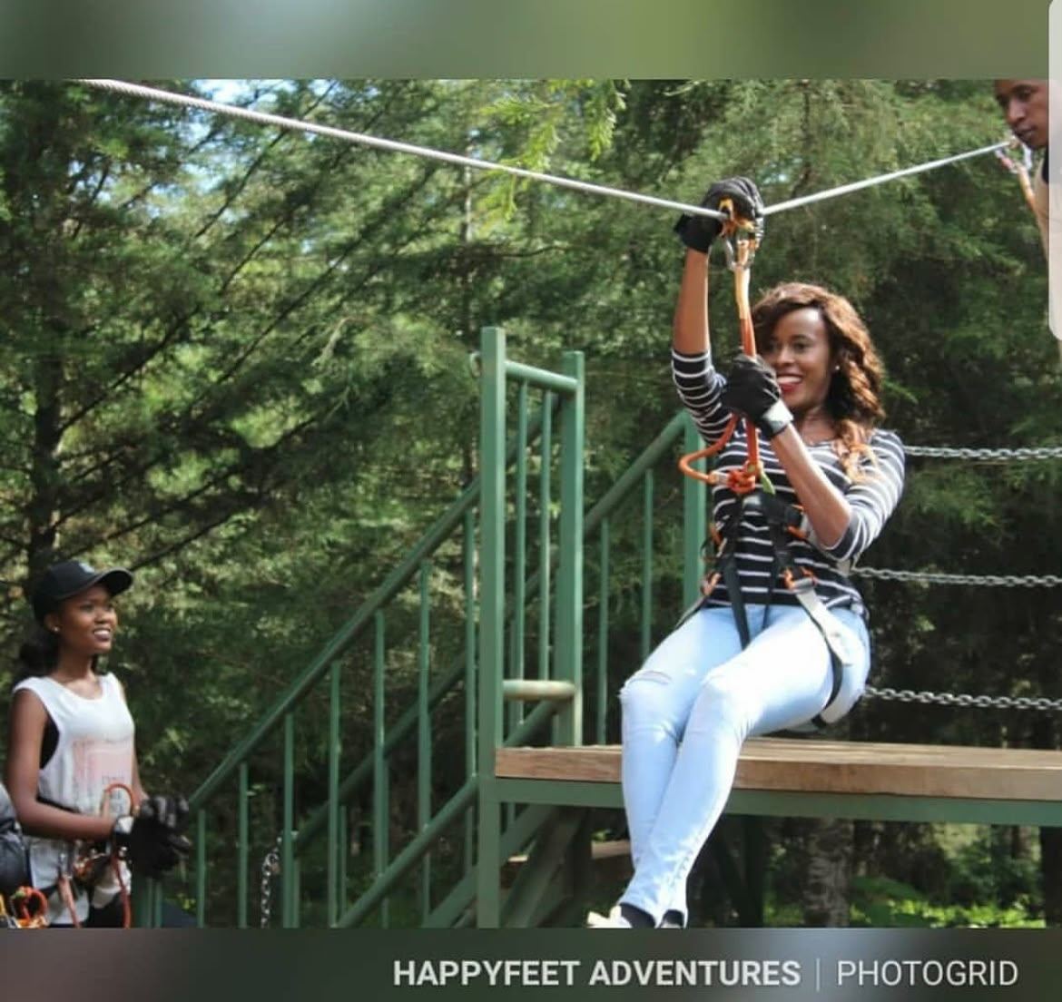 Guests ziplining at a HappyFeet adventure